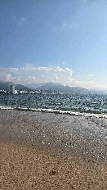 istock On the beach with view on the city - Vertical 2194471384