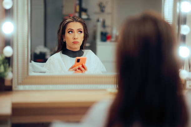 istock Bored Woman Feeling Checking Phone While Waiting in hair Salon 2194471862