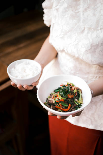 istock Aromatic Stir-Fried Hot Basil Dish with Vibrant Vegetables Paired with Steamed Jasmine Rice Served in a Traditional Thai Style at an Authentic Thai Restaurant 2194478731