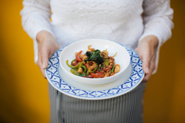 istock Traditional Thai Stir-Fried Hot Basil Dish Served on a Decorative Plate, Vibrant Colors of Fresh Ingredients Highlighting Authentic Flavors and Culinary Art 2194478973