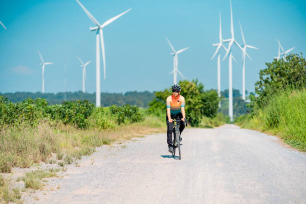 istock Cyclists on a countryside on windmills. 2194479249