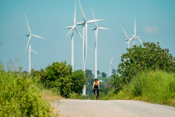 istock Cyclists on a countryside on windmills. 2194479274
