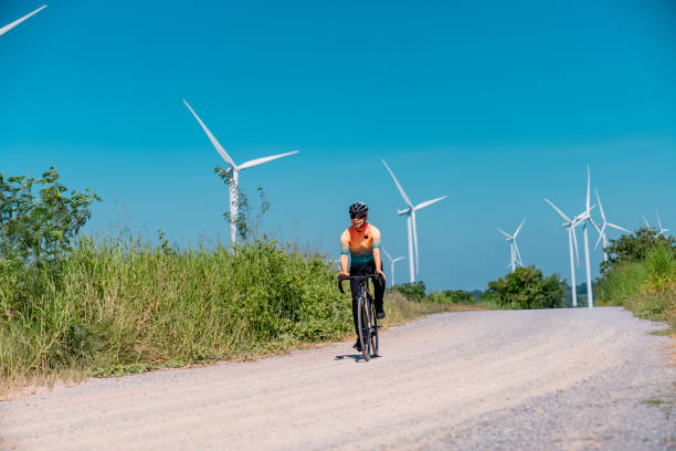 istock Cyclists on a countryside on windmills. 2194479291
