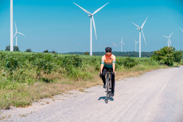 istock Cyclists on a countryside on windmills. 2194479304