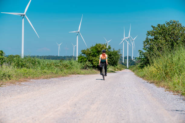 istock Cyclists on a countryside on windmills. 2194479326