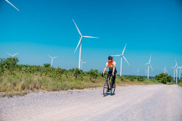istock Cyclists on a countryside on windmills. 2194479337