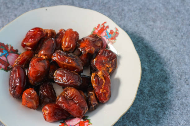 istock Date palm in a white plate 2194480437