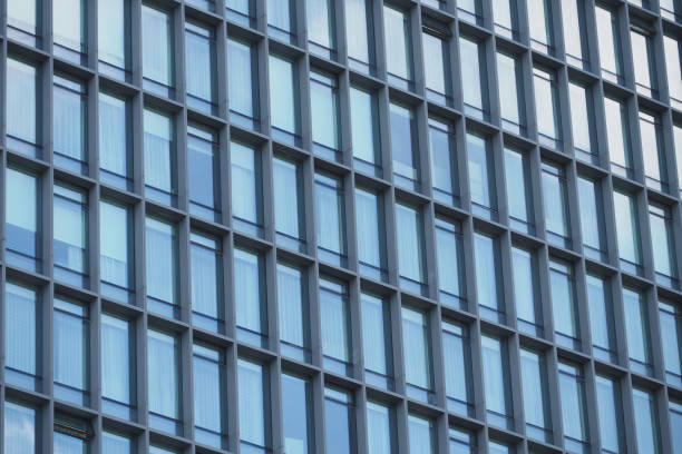 istock A modern office building facade with large glass windows that reflect its surroundings 2194484026