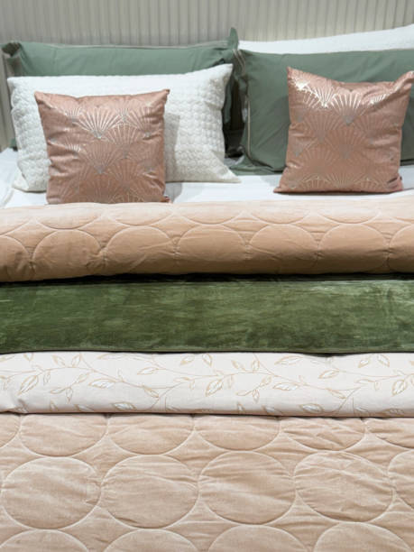 istock Image of elegantly coordinated brown, green, gold bedroom / luxuriously lined bed with pillows, cushions 2194485153