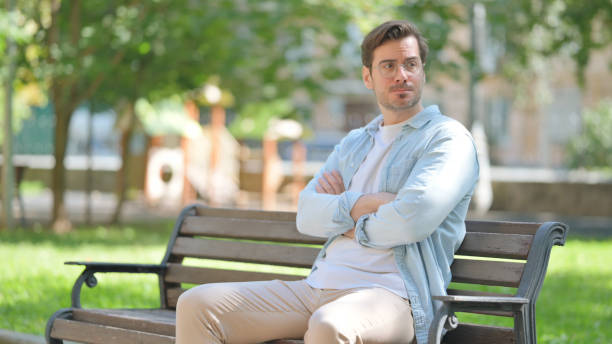 istock Tense Middle Aged Man in Frustration while Sitting in Park 2194485572