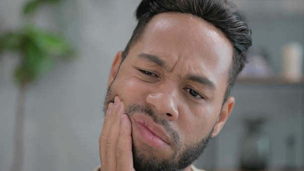 istock Close up of Hispanic Man with Toothache 2194487117