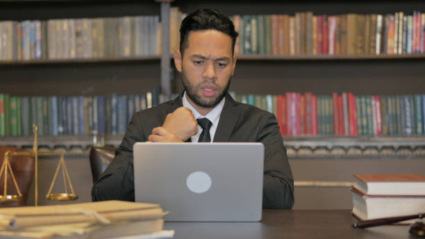 istock Hispanic Judge having Wrist Pain with Laptop 2194487306