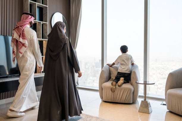 istock Young Arabic Family Admiring Riyadh Skyline from Modern Home 2194497489