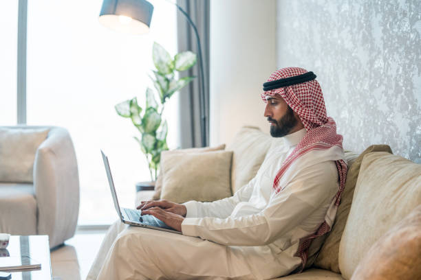 istock Focused Arabic Businessman Working on Laptop in Modern Home 2194497531