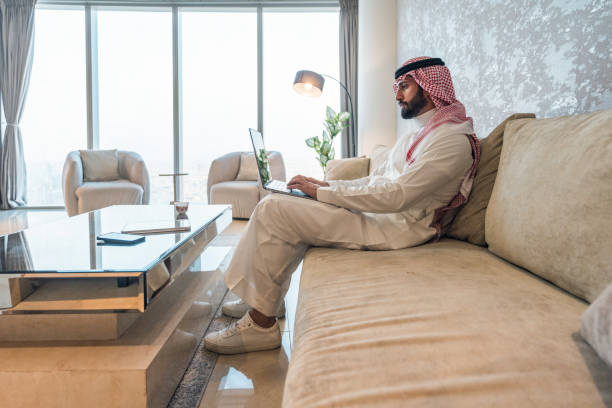 istock Focused Arabic Businessman Working on Laptop in Modern Home 2194497534