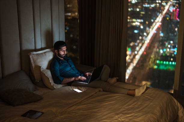 istock Relaxed Arabic Male Using Smartphone in Modern Riyadh Apartment 2194497712