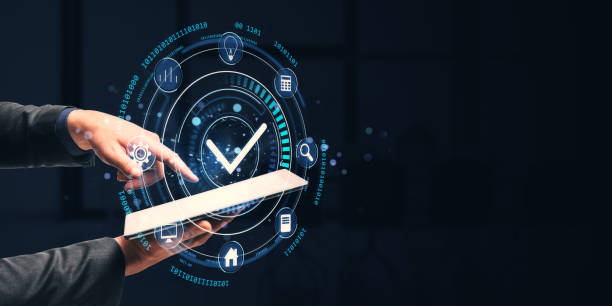 istock Digital interface with a checkmark hologram above a tablet held by hands in a dark background. Concept of technology and user interaction. 2194499039