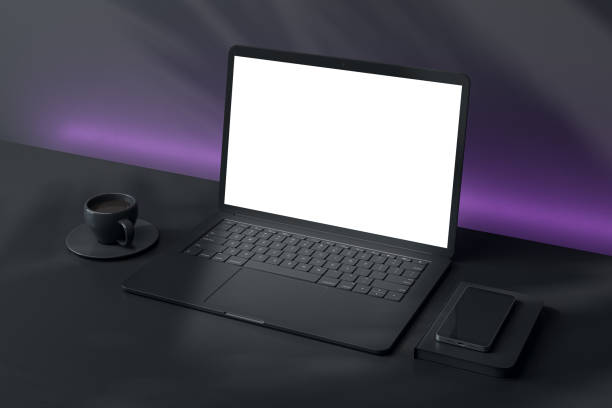 Blank laptop screen mockup on a desk with coffee cup and smartphone in a modern setting. 3D Rendering