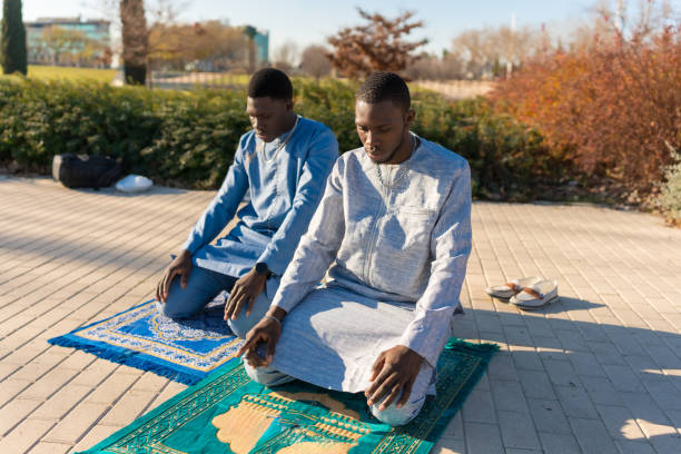 istock Two senegalese men praying outdoors during ramadan 2194501494
