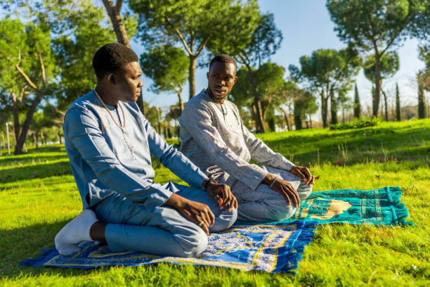 istock Two senegalese men praying outdoors during ramadan 2194501624