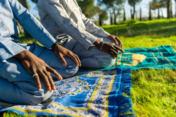 istock Senegalese muslims praying outdoors during ramadan 2194501647