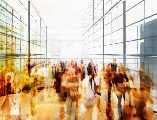 Motion blurred people shopping in mall