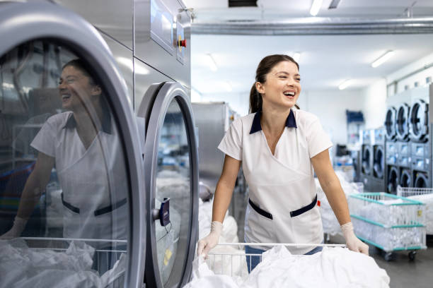 istock Professional cleaner working in dry cleaning service. 2194507189