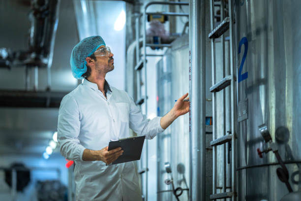 istock Professional worker analyzing operational data on production equipment in a state-of-the-art food factory Prioritizing efficiency and safety compliance. 2194509028