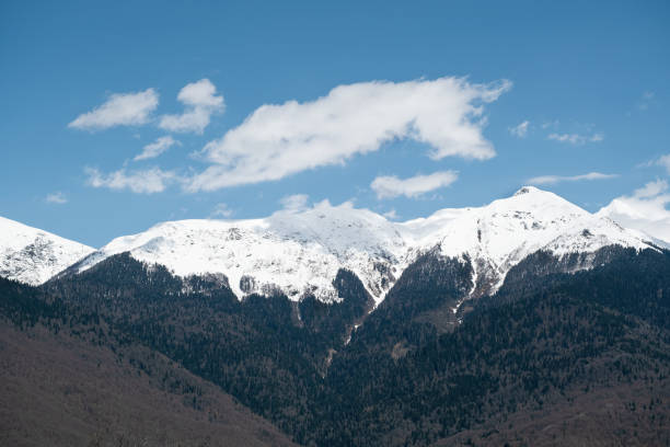 istock Majestic snow-capped mountains under a clear blue sky in a serene landscape 2194509073
