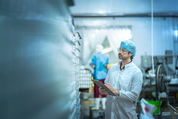 istock Inspector performing quality checks in a modern food production facility Focus on precision safety and workflow optimization in industrial manufacturing. 2194509075