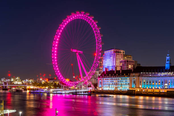 London, UK - May 31, 2025 - a portion of the London Eye or the iconic observation wheel, showcasing its distinctive white structure and numerous enclosed capsules around its circumference, is a large cantilevered observation wheel situated on the South Bank of the River Thames in London.