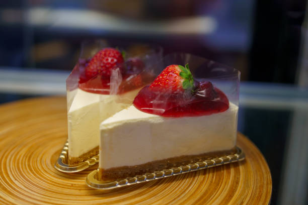 istock Two pieces of strawberry cheesecake 2194509531