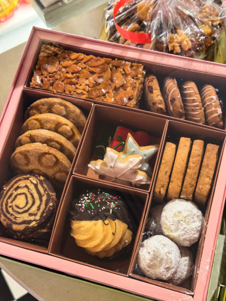istock Image of delicious christmas cookies and biscuits selection in box /  chocolate chip, icing, brownies, cakes 2194510468