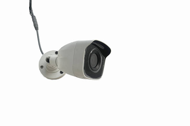istock A camera CCTV is hanging from a cord. The camera is white and black, isolated on white background 2194511410