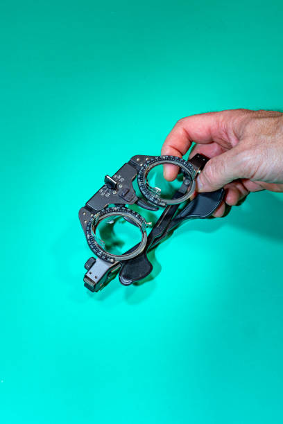 istock Detail of optometry glasses and doctor's hand 2194511678