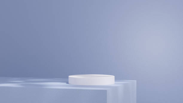istock Product display stands, along with a podium, are set against a blue background with soft, subtle shadows in a landscape orientation. 2194512245