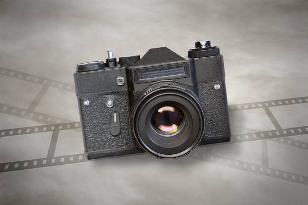 istock black retro photo camera on sepia background 2194513084
