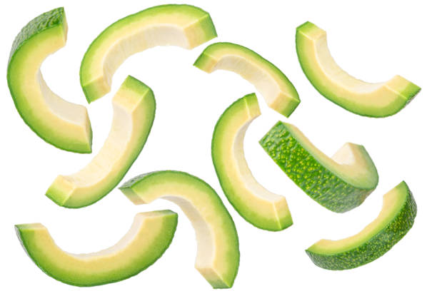 istock Falling avocado slices isolated on white background. Organic Avocado 2194514186