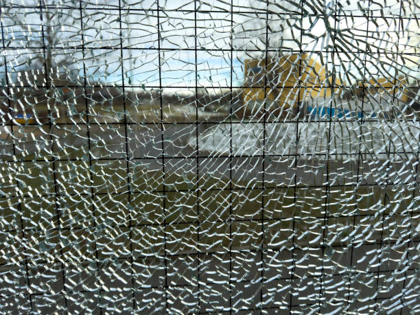 istock Cracks in the glass on the window after a break-in 2194514630