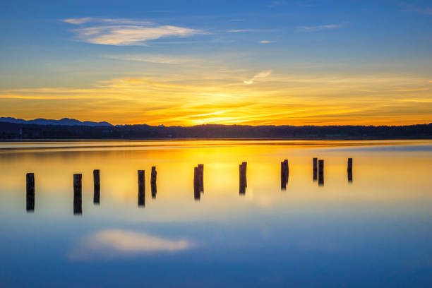 Old landing stage in the sunset on Lake Starnberg, Fuenfseenland, Upper Bavaria, Bavaria, Germany, Europe