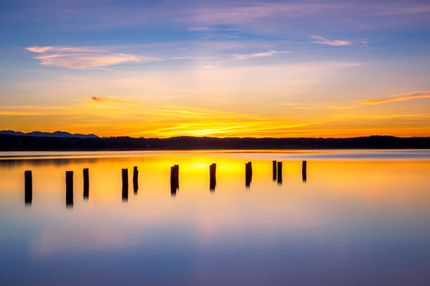 Old landing stage in the sunset on Lake Starnberg, Fuenfseenland, Upper Bavaria, Bavaria, Germany, Europe