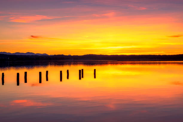 Old landing stage in the sunset on Lake Starnberg, Fuenfseenland, Upper Bavaria, Bavaria, Germany, Europe