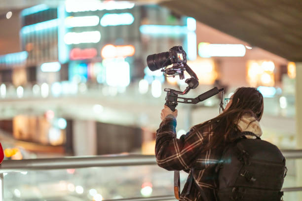 istock Cameraman using gimbal in street at night. 2194519096