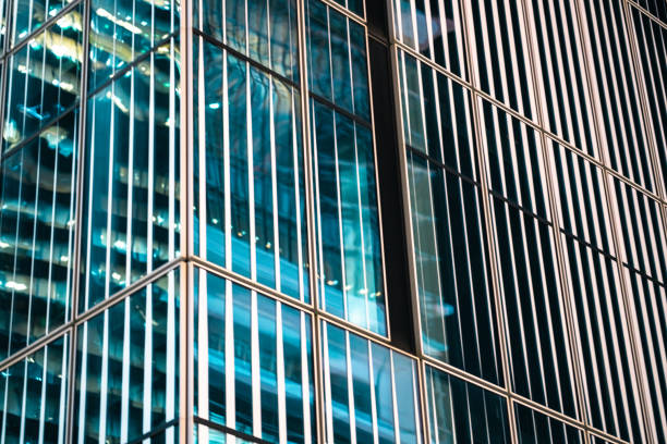 Office building exteriors at night.