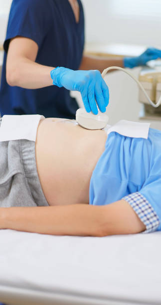 istock elder receive abdominal ultrasound 2194520124