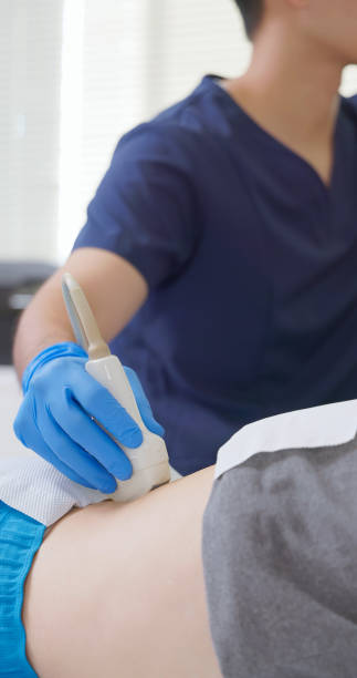 istock asian Doctor Scans Lower Back 2194520386