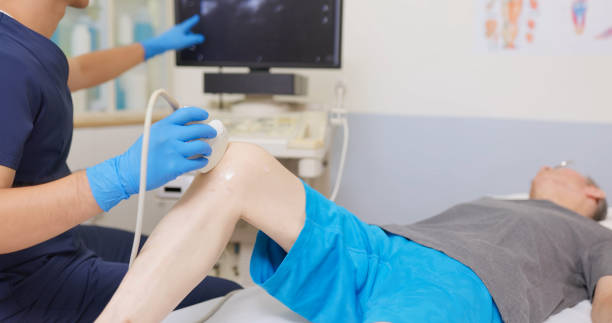 istock asia Doctor Perform Knee Ultrasound 2194521396