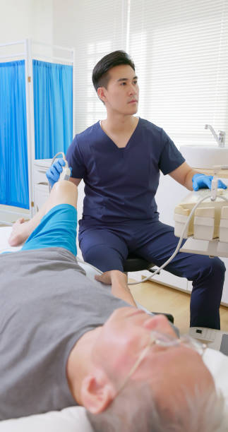 istock asia Doctor Perform Knee Ultrasound 2194521456
