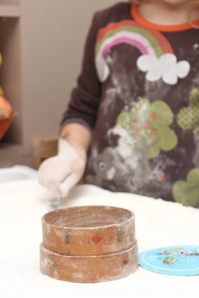 istock Child engaged in creative baking activity at home kitchen with flour and tools for making pastries 2194522241