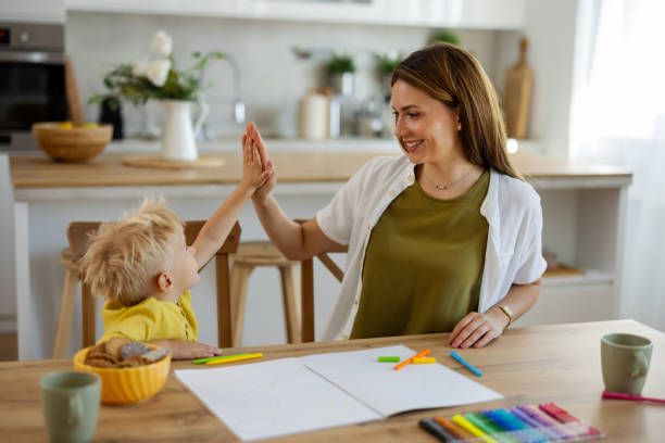 istock Cozy Family Moment: Mother and Son Engaged in Drawing and Creative Fun 2194522554